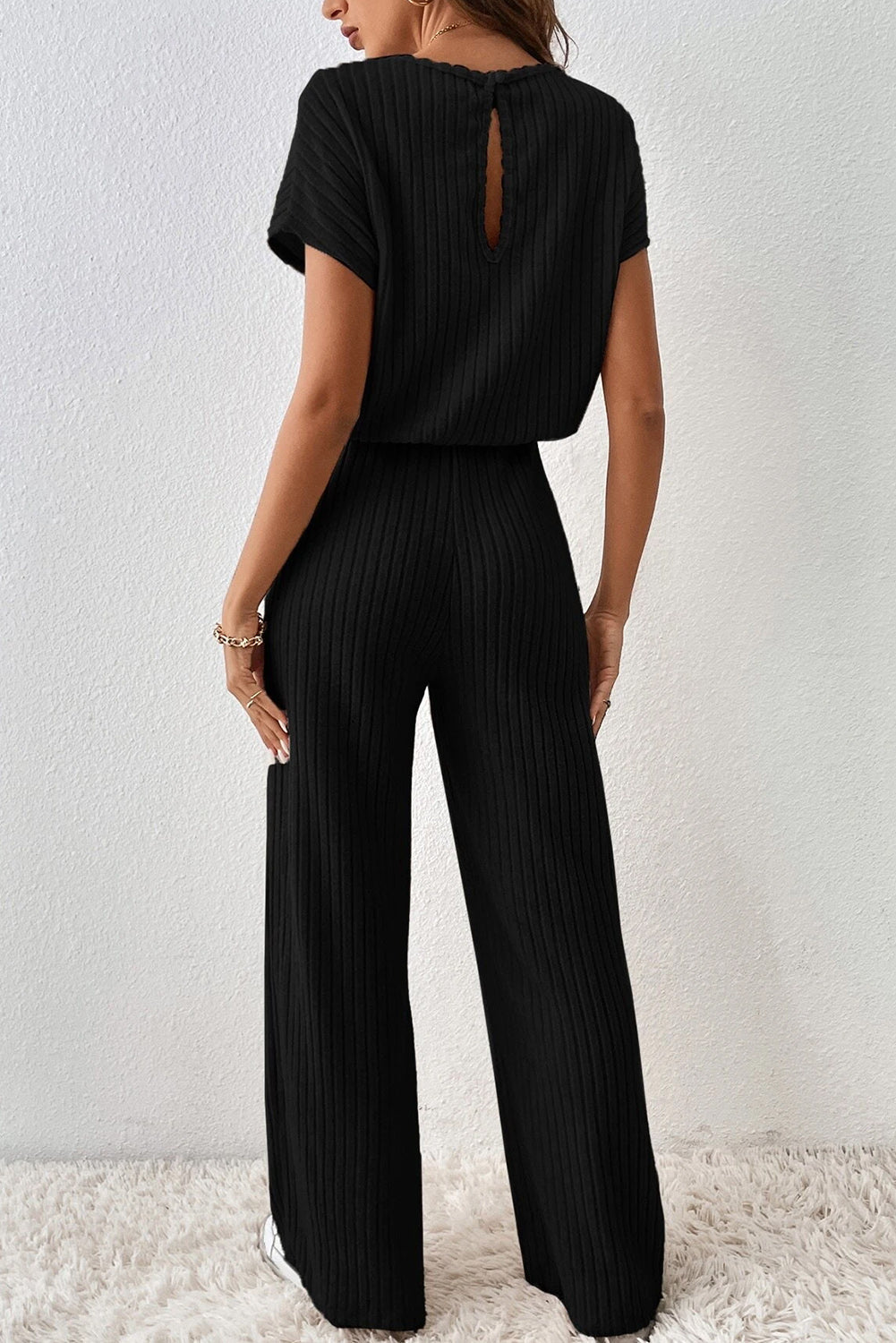 Sloan | Zwarte geribbelde jumpsuit met wijde pijpen